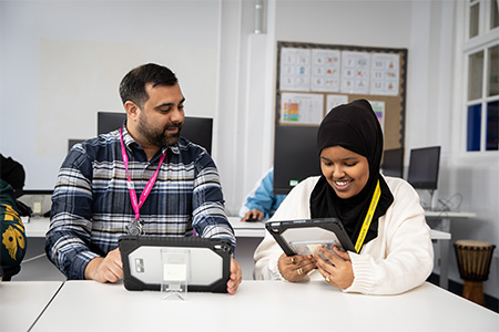Teacher helping a student in the classroom